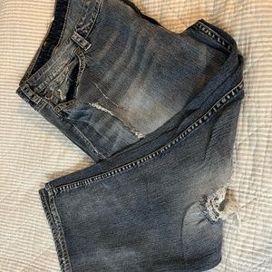 Distressed silver jeans